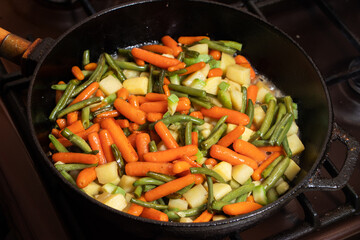 Vegetable stew in a frying pan.