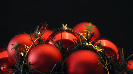 Red Christmas balls on a black background