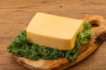 Tasty yelloow Tilsiter cheese brick