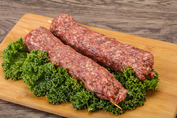 Raw minced beef kebab skewer