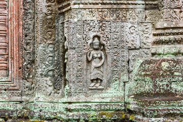 statue of a Devata deities with an enigmatic smile in Preah Khan temple, in Angkor Thom in Siem Reap Cambodia