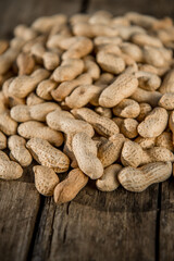 Dried peanuts closeup photo. Peanut in the shell. Food background of peanuts, healthy vegan food