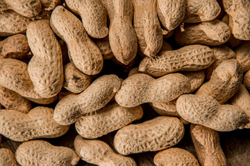 Dried peanuts closeup photo. Peanut in the shell. Food background of peanuts, healthy vegan food