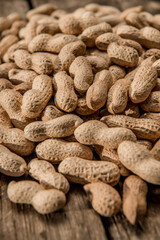 Dried peanuts closeup photo. Peanut in the shell. Food background of peanuts, healthy vegan food