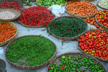 a lot of fresh vegetables are being sold at the market, food ingredients at street/traditional market. top view.