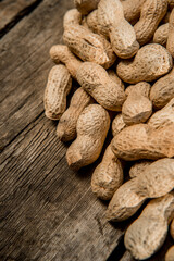 Dried peanuts closeup photo. Peanut in the shell. Food background of peanuts, healthy vegan food
