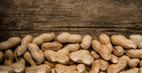 Dried peanuts closeup photo. Peanut in the shell. Food background of peanuts, healthy vegan food