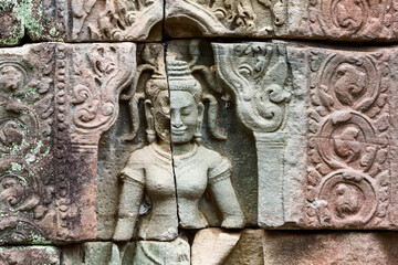 statue of a Devata deities with an enigmatic smile in Preah Khan temple, in Angkor Thom in Siem Reap Cambodia