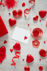 St. Valentine's day decorations on white wooden surface