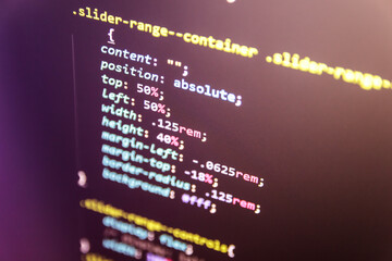 Web code close up. Laptop screen with CSS code