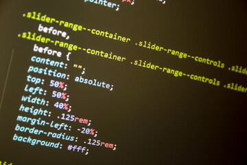 Wordpress theme code close up. Laptop screen with CSS code