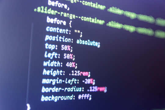 Web code close up. Laptop screen with CSS code
