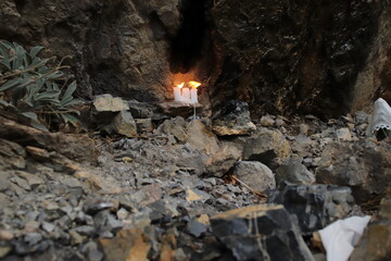 
lighted candles for wishes or making vows, placed in places thought to be sacred