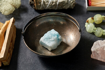 occult science and supernatural concept - different staff for magic ritual on slate stone background