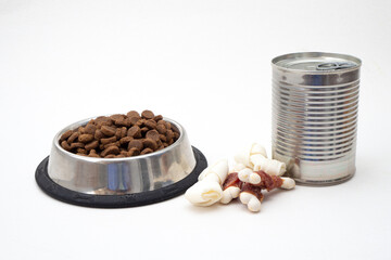 Dog treats and dry feed in bowl on white background . Variety of dog treats.