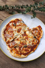 Homemade cheese pizza on a wooden table