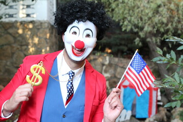 Patriotic clown waving the national flag