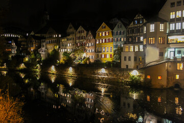 Fototapeta na wymiar Tubingen at night , view of colorful houses in riverside.Famous old town in Germany, tourism and travel concept.