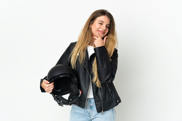 Woman holding a motorcycle helmet isolated on white background happy and smiling