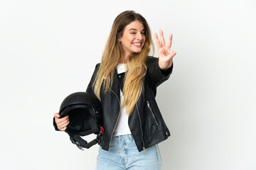 Obraz premium Woman holding a motorcycle helmet isolated on white background happy and counting three with fingers