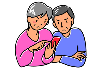 怒った表情でスマホを見るシニア夫婦