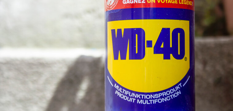 Krakow, Poland - June 16, 2020: WD-40 logo multifunctional spray bottle close-up.