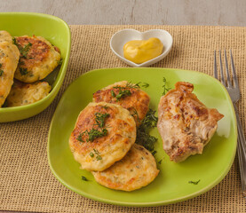Cabbage pancakes and grilled chicken leg.