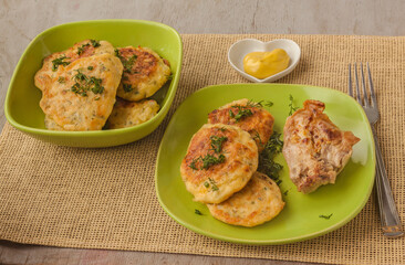 Cabbage pancakes and grilled chicken leg.