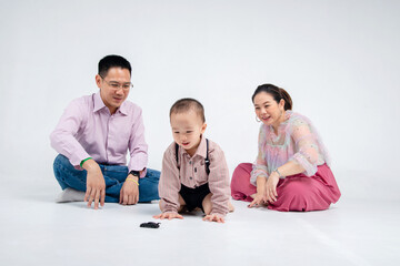Fototapeta premium Asian chinese family palying with his little son