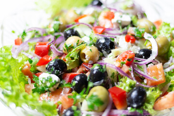 greek salad texture with feta cheese, olives, tomato, onion, cucumber, parsley, oil