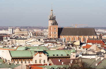 Obraz premium Krakow, Poland - February 17, 2019: Tower of the church of St. Mary in Krakow seen from the window of the zygmunt bell