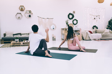 Flexible sportspeople doing yoga together
