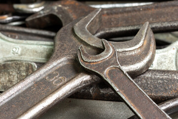 A box with a set of old rusty locksmith tools.