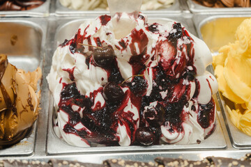 Close up of artisan organic ice cream with different flavors on market stall