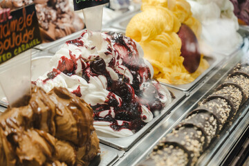 Close up of artisan organic ice cream with different flavors on market stall