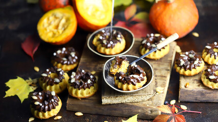 Obraz na płótnie Canvas Selective focus. Macro. Delicious pumpkin cakes. Beautiful autumn dessert. A healthy pumpkin dessert.
