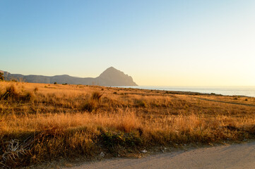 Fototapeta premium Breathtaking sunset by the sea at Macari's Belvedere viewpoint in Sicily near San Vito Lo Capo