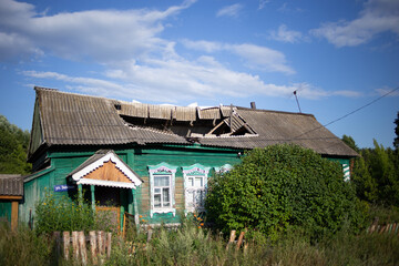 Fototapeta na wymiar Destroyed old house in the village