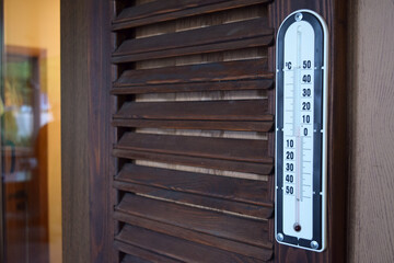 thermometer on the wooden wall