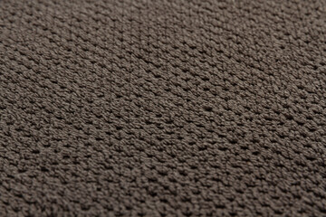gray cotton terry towel lies on a flat surface close-up