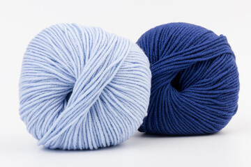 woolen merinos blue threads on white background. natural wool. knitting. background