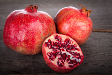pomegranates on a wooden table