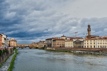 Fototapeta premium Arno River with Architecture in Florence Italy