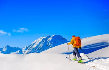 Fotobehang Skitouring with amazing view of swiss famous mountains in beautiful winter powder snow of Alps. © Gorilla