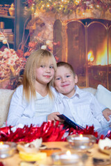 Fototapeta premium baby, beautiful, blanket, book, brother, celebration, child, childhood, children, christmas, cute, daughter, december, decorated, decoration, eve, evening, fairy, family, fun, girl, happiness, happy, 