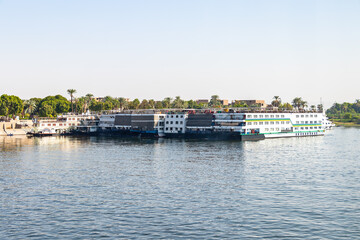 Fototapeta na wymiar A lot of Floating hotels (tourist boats) moored between Luxor and Aswan in central Egypt for lack of tourism