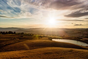 Naklejka premium Italian Landscape Panorama with Silhouetted Mountains and Cloudscape