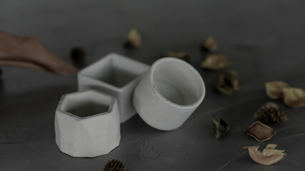 Mini cement pots are kept on nice concrete background as display item