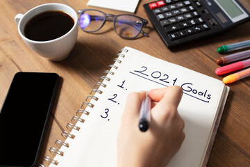 Fototapeta na wymiar New Year's Solution Goal List 2021. Handwritten notebook about New Year's goals and resolutions plan list.