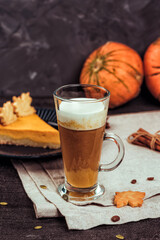 Pumpkin spicy latte with autumn cookies and sweet pie.